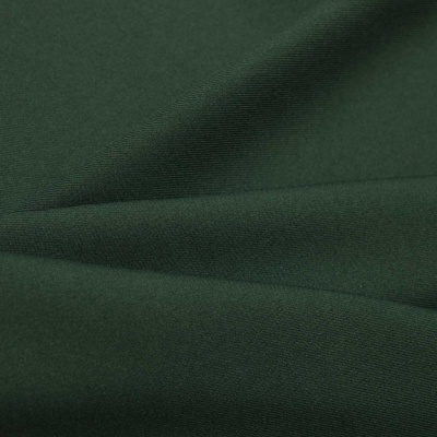 Ткань костюмная 21010 2076, 225 гр/м2, шир.150см, цвет т.зеленый - купить в Коврове. Цена 390.73 руб.